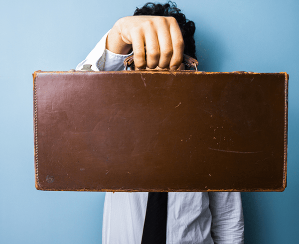 Person holding a leather case