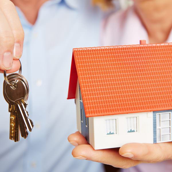 Person holding house keys